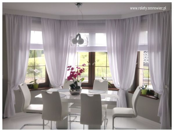 Eleganckie rolety rzymskie i przytulne zasłony - styl i funkcjonalność w Twoim wnętrzu.